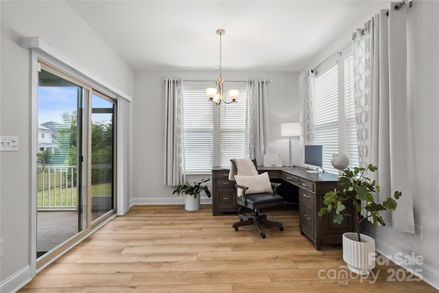 1287 Fishing Creek Rd, Lake Wylie, SC 29710 - home office featuring a chandelier, light wood-style flooring, healthy amount of natural light, and baseboards