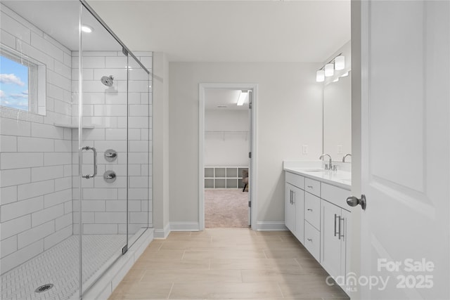1287 Fishing Creek Rd, Lake Wylie, SC 29710 - full bath with a shower stall, vanity, wood finish floors, a walk in closet, and baseboards