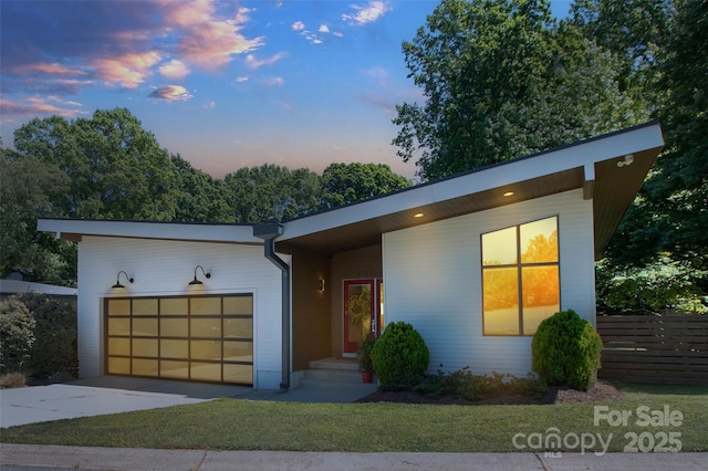 modern home featuring an attached garage and driveway