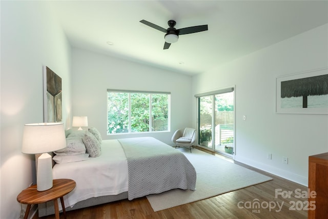bedroom with lofted ceiling, wood finished floors, baseboards, access to outside, and a ceiling fan