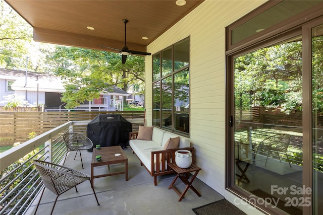 balcony featuring area for grilling and outdoor lounge area