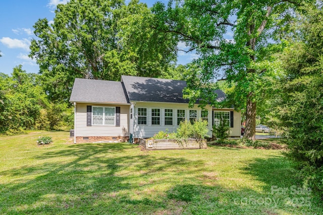 814 Independence Dr, Wingate, NC 28174 - back of house with a garden, roof with shingles, a yard, and crawl space