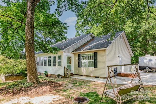 814 Independence Dr, Wingate, NC 28174 - view of front of house featuring a shingled roof, an outdoor fire pit, crawl space, entry steps, and a patio