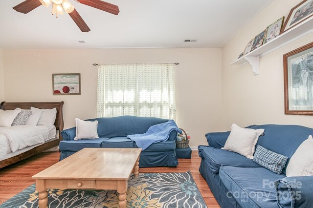 814 Independence Dr, Wingate, NC 28174 - living room featuring visible vents, ceiling fan, and wood finished floors