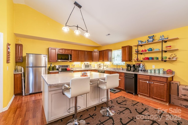 814 Independence Dr, Wingate, NC 28174 - kitchen with appliances with stainless steel finishes, a sink, and light wood finished floors