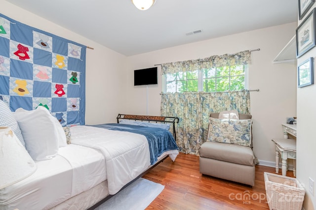 814 Independence Dr, Wingate, NC 28174 - bedroom featuring wood finished floors and visible vents