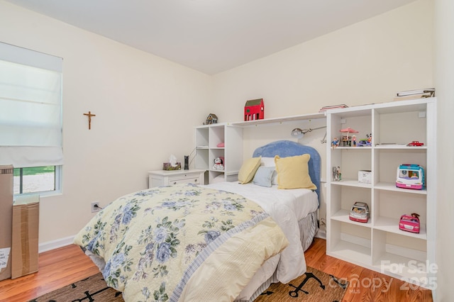 814 Independence Dr, Wingate, NC 28174 - bedroom with baseboards and wood finished floors