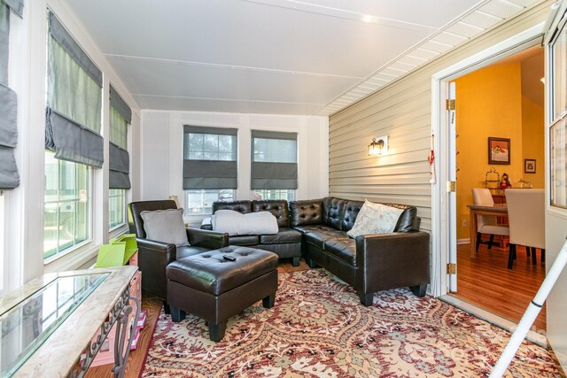 814 Independence Dr, Wingate, NC 28174 - living room featuring wood walls, wood finished floors, and a wealth of natural light