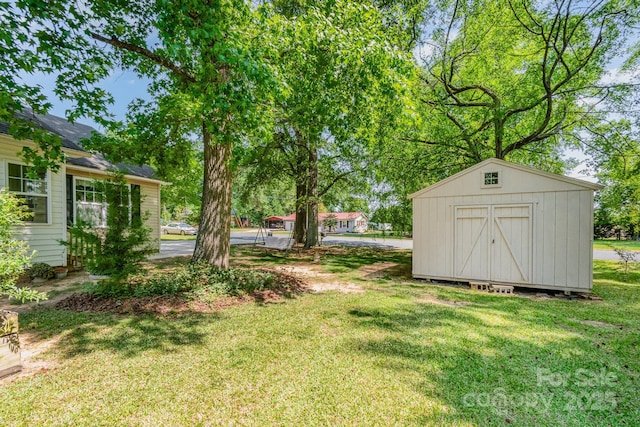 814 Independence Dr, Wingate, NC 28174 - view of yard with a storage shed and an outdoor structure