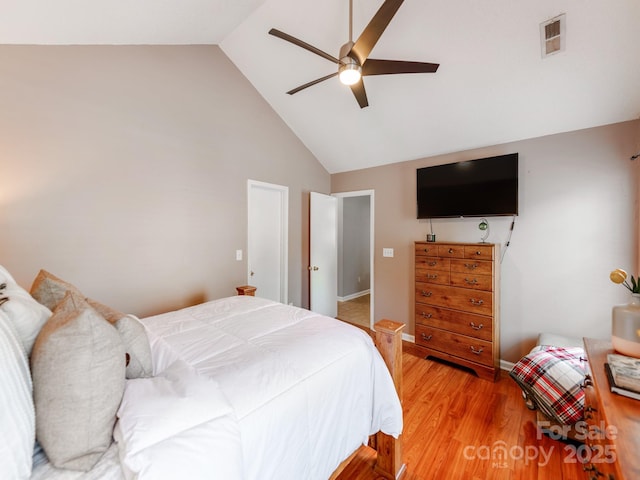 bedroom with high vaulted ceiling, light wood-style flooring, and ceiling fan
