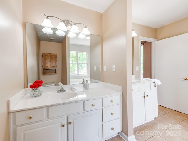 bathroom with tile patterned floors and vanity