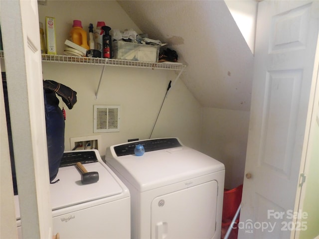 laundry area featuring laundry area, visible vents, and washer and dryer