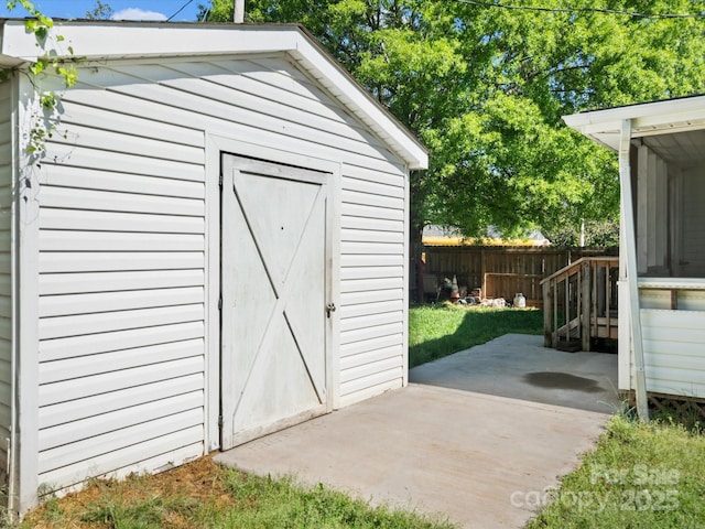 view of shed with fence