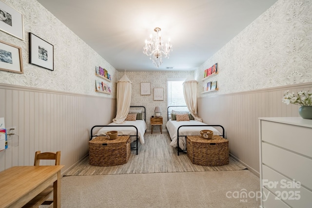 804 Lyndon Station Dr, Pineville, NC 28134 - living area with wallpapered walls, a notable chandelier, wainscoting, and visible vents