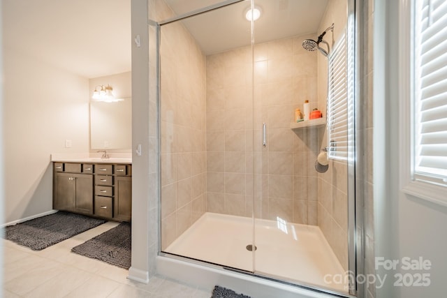 804 Lyndon Station Dr, Pineville, NC 28134 - bathroom with vanity, baseboards, tile patterned flooring, and a stall shower