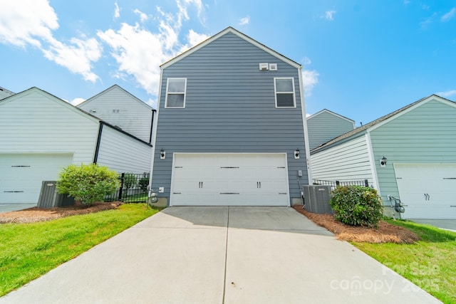 804 Lyndon Station Dr, Pineville, NC 28134 - view of front of property featuring an attached garage, fence, driveway, and cooling unit