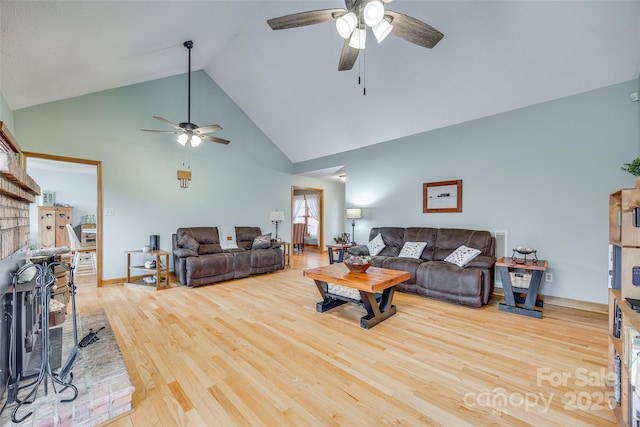 living room with wood finished floors, a ceiling fan, high vaulted ceiling, and baseboards
