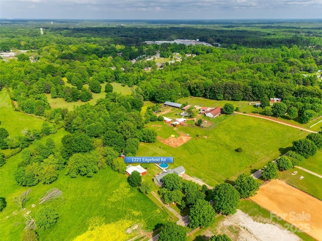 bird's eye view featuring a wooded view