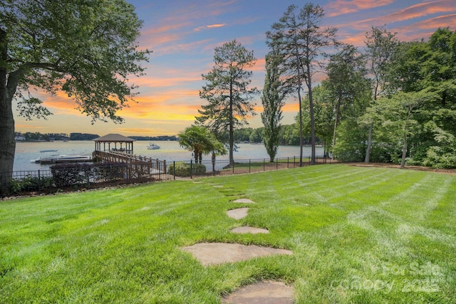 17112 Green Dolphin Ln, Cornelius, NC 28031 - yard at dusk with a water view and fence