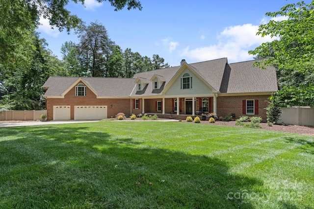 17112 Green Dolphin Ln, Cornelius, NC 28031 - new england style home featuring brick siding, a chimney, fence, and a front yard