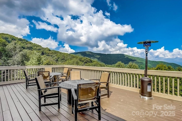 1873 El Miner Dr, Mars Hill, NC 28754 - wooden terrace featuring a mountain view and outdoor dining space