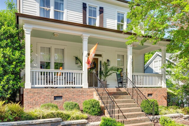 doorway to property with a porch