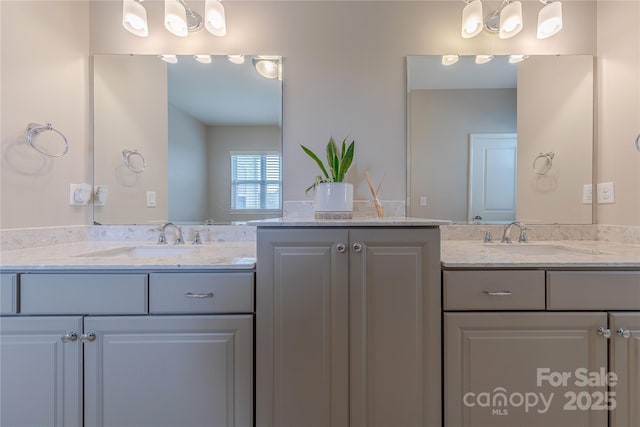 full bathroom featuring two vanities and a sink