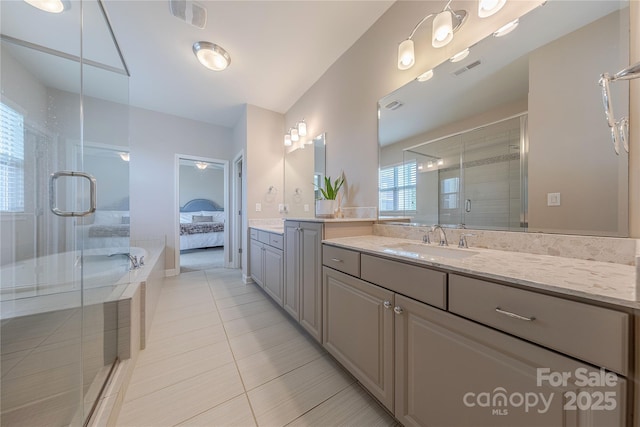 bathroom with vanity, visible vents, a shower stall, and tile patterned flooring