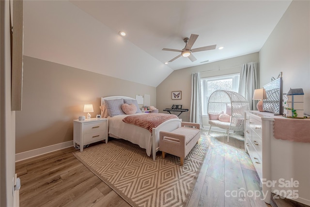 bedroom featuring recessed lighting, light wood-style floors, a ceiling fan, vaulted ceiling, and baseboards