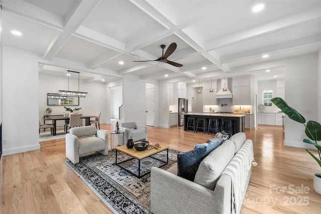 living room with light wood-style floors, a ceiling fan, coffered ceiling, and recessed lighting