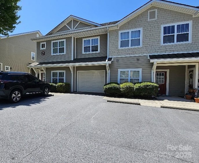 view of front of home with an attached garage and driveway