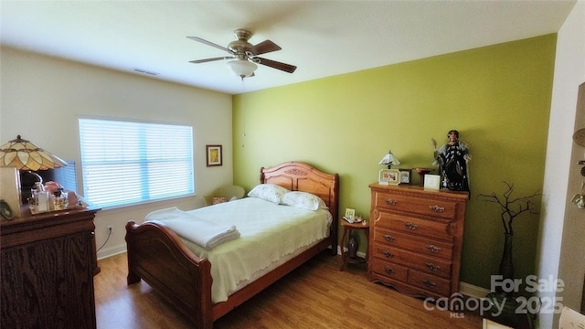 93 Foxden Dr Unit 101, Fletcher, NC 28732 - bedroom featuring wood finished floors, ceiling fan, and baseboards