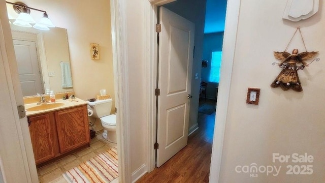 93 Foxden Dr Unit 101, Fletcher, NC 28732 - half bathroom with toilet, vanity, and wood finished floors