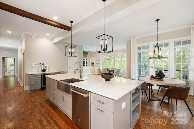 kitchen featuring a sink, dishwasher, a chandelier, and a healthy amount of sunlight
