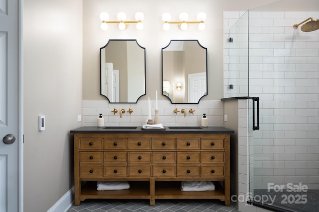 bathroom featuring tile patterned floors, a stall shower, and vanity