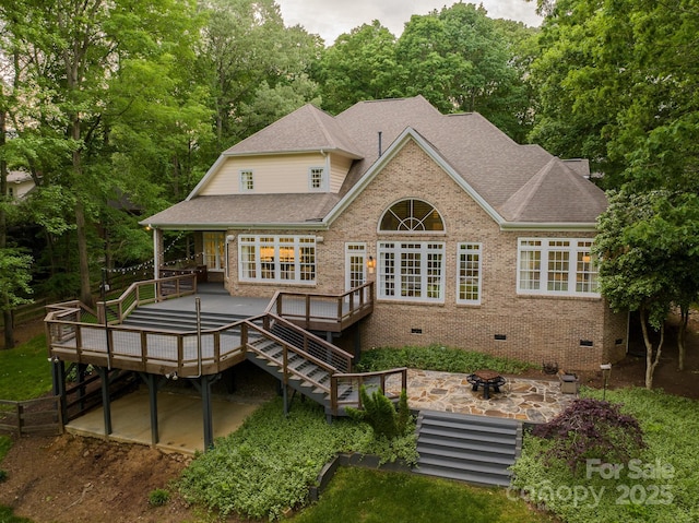 back of house featuring a fire pit, a patio, a wooden deck, a shingled roof, and crawl space