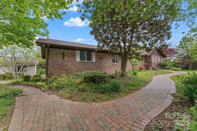 view of home's exterior featuring brick siding