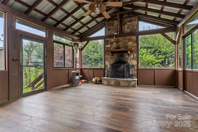 unfurnished sunroom with beam ceiling