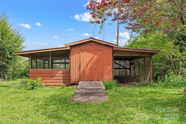 view of outbuilding featuring an outdoor structure