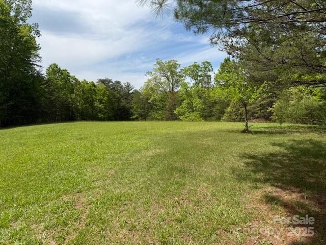 view of yard with a forest view