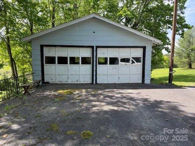 detached garage with fence