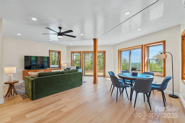 dining area with recessed lighting, baseboards, a ceiling fan, and light wood-style flooring