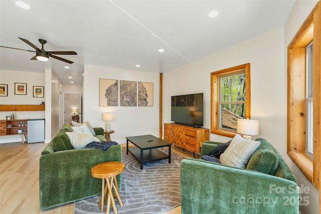 living room with recessed lighting, a ceiling fan, and wood finished floors