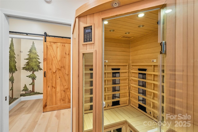 view of sauna with recessed lighting and wood finished floors