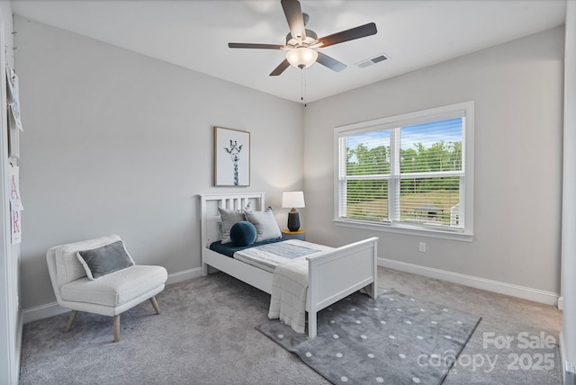 bedroom with carpet flooring, a ceiling fan, baseboards, and visible vents