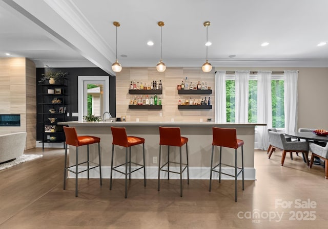 2915 Cutter Ct, Waxhaw, NC 28173 - indoor wet bar with ornamental molding, plenty of natural light, decorative light fixtures, recessed lighting, and a high end fireplace