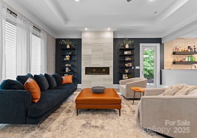 2915 Cutter Ct, Waxhaw, NC 28173 - living area featuring a tray ceiling, recessed lighting, a high end fireplace, and bar area