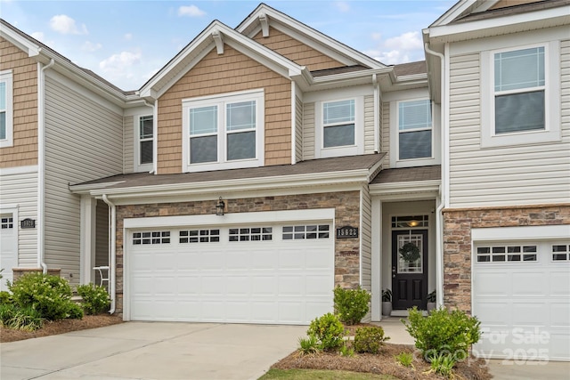 15622 Little Bluestem St, Charlotte, NC 28278 - view of property featuring a garage, driveway, and stone siding