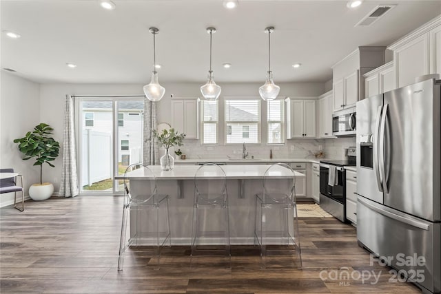 15622 Little Bluestem St, Charlotte, NC 28278 - kitchen featuring stainless steel appliances, a sink, plenty of natural light, a center island, and recessed lighting