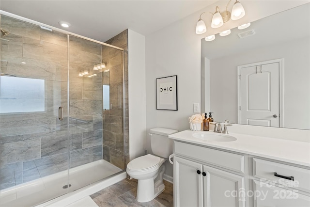 15622 Little Bluestem St, Charlotte, NC 28278 - bathroom featuring toilet, vanity, a shower stall, and baseboards